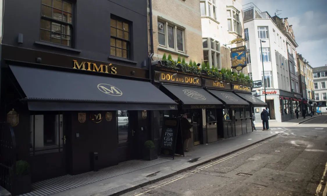 Part of street and dark building